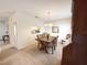 Cozy dining area with a wooden table and chairs, with a view to the kitchen at 4387 Sambourne St, Clermont, FL 34711