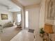Foyer featuring a tiled floor, front door, and a view of the living room and sitting area at 4387 Sambourne St, Clermont, FL 34711