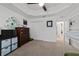 Bedroom with canopy bunk bed, neutral walls, and closet access at 4972 Big Cypress St, Oxford, FL 34484