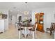 Bright dining room featuring a modern chandelier and an open concept view of the home's interior at 4972 Big Cypress St, Oxford, FL 34484