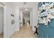 Bright entryway with tile flooring, neutral walls, and a view into the home's interior at 4972 Big Cypress St, Oxford, FL 34484