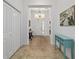 Open entryway featuring tile floors, white walls, and a view of the home's interior at 4972 Big Cypress St, Oxford, FL 34484