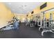 The fitness center includes exercise equipment, weight machines, ceiling fans, and ample natural light at 4972 Big Cypress St, Oxford, FL 34484