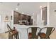 Beautiful kitchen featuring stainless steel appliances, granite countertops, and breakfast bar seating at 4972 Big Cypress St, Oxford, FL 34484