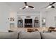 Cozy living room featuring a decorative fireplace and an open view into a bedroom at 4972 Big Cypress St, Oxford, FL 34484