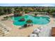 The community pool features a rock grotto, a large lounging deck, and plenty of seating for residents at 4972 Big Cypress St, Oxford, FL 34484
