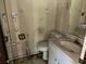 Small bathroom with a sink, toilet, vanity and mirror at 504 S 12Th St, Leesburg, FL 34748