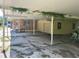 Wide angle of the carport reveals the covered parking and garage at 504 S 12Th St, Leesburg, FL 34748