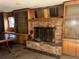 Living room brick fireplace with built-in cabinets and a decorative mantel at 504 S 12Th St, Leesburg, FL 34748