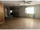 Bright and airy living space with tiled floors, wood paneling, and large windows at 504 S 12Th St, Leesburg, FL 34748