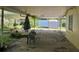 Outdoor patio area with a table and chairs at 504 S 12Th St, Leesburg, FL 34748