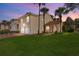 Charming two-story townhome with a well-manicured lawn, two-car garage, and a beautiful terracotta tile roof at 5340 Edgewater Way # 1, Oxford, FL 34484