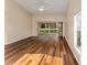 Spacious living room featuring hardwood flooring, a ceiling fan, and a sliding glass door to the outdoor patio at 5340 Edgewater Way # 1, Oxford, FL 34484
