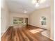 Spacious living room with hardwood floors and access to the lanai at 5340 Edgewater Way # 1, Oxford, FL 34484