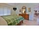 Comfortable bedroom with wooden furniture, and a view of the dining area at 631 San Pedro Dr, The Villages, FL 32159