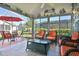 Screened-in lanai with patio furniture, perfect for enjoying the outdoors year round at 631 San Pedro Dr, The Villages, FL 32159