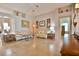 Bright living room boasting tile flooring, neutral tones, and comfortable seating arrangements at 631 San Pedro Dr, The Villages, FL 32159