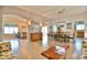 Spacious open-concept living room with tile floors, high ceilings, and an easy flow into the dining and kitchen areas at 631 San Pedro Dr, The Villages, FL 32159