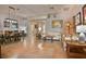 Expansive living room featuring tile flooring, a ceiling fan, access to other rooms, and neutral-colored walls at 631 San Pedro Dr, The Villages, FL 32159