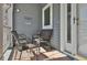 Cozy front porch with seating area, offering a welcoming entrance to the home at 631 San Pedro Dr, The Villages, FL 32159