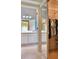 Walk-in closet leading to an ensuite bathroom with double vanities and granite countertops at 631 San Pedro Dr, The Villages, FL 32159