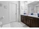 Bathroom featuring double sinks with modern cabinets, and tile flooring at 6401 Domenico Ct, Groveland, FL 34736