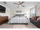 Bright bedroom featuring a seating area and a ceiling fan at 6401 Domenico Ct, Groveland, FL 34736