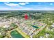 Aerial view of a neighborhood featuring a community pool and ponds at 644 Orange Belt Loop, Winter Garden, FL 34787