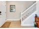 Warm foyer with staircase and natural lighting that provides a bright and inviting welcome at 644 Orange Belt Loop, Winter Garden, FL 34787