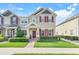 Charming two-story townhome with a welcoming entrance and nicely manicured front yard at 644 Orange Belt Loop, Winter Garden, FL 34787
