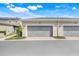 A straight-on view of the garages for these attached townhomes at 644 Orange Belt Loop, Winter Garden, FL 34787