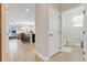 Hallway leads to living area and bathroom, showcasing the home's functional layout at 644 Orange Belt Loop, Winter Garden, FL 34787