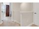 Neutral colored hallway has carpeting and entryways to a bedroom and closet at 644 Orange Belt Loop, Winter Garden, FL 34787