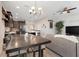 This open living area features a dining room, kitchen with dark cabinets, and a comfortable living space at 644 Orange Belt Loop, Winter Garden, FL 34787