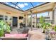 Enjoy this screened in patio with brick pavers, comfortable seating and an outdoor grill at 644 Orange Belt Loop, Winter Garden, FL 34787