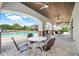 Community pool with a covered seating area and a grilling area at 644 Orange Belt Loop, Winter Garden, FL 34787