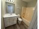 Standard bathroom with tub and vanity at 677 Warner St, Groveland, FL 34736