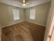 Bedroom featuring carpeted floors and good natural light at 677 Warner St, Groveland, FL 34736