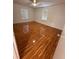 This bedroom features tile flooring and two windows at 677 Warner St, Groveland, FL 34736