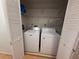 Convenient laundry closet featuring a washer and dryer at 677 Warner St, Groveland, FL 34736