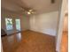 Bright living room with tiled floors and sliding doors that leads to outdoor area at 677 Warner St, Groveland, FL 34736
