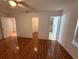Main bedroom with tiled floors leading to a walk-in closet and bathroom at 677 Warner St, Groveland, FL 34736