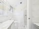 Bright bathroom featuring tiled floors, a vanity with sink, a toilet, and a shower-tub combination at 715 Megan Circle, The Villages, FL 32159