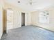 Bright bedroom with plush carpeting, a closet, and natural light creates a cozy atmosphere at 715 Megan Circle, The Villages, FL 32159