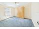 Cozy bedroom with plush carpeting and ample closet space at 715 Megan Circle, The Villages, FL 32159