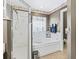 A well lit bathroom includes a standalone shower, jacuzzi tub, and floral accents at 7260 Se 124Th Ln, Belleview, FL 34420
