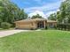 Charming single-story home with a well-manicured lawn and a two-car garage at 7260 Se 124Th Ln, Belleview, FL 34420