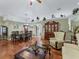 Open-concept living room with hardwood floors and dining area, perfect for entertaining at 7260 Se 124Th Ln, Belleview, FL 34420