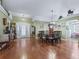 Living room and dining area with an open floor plan and lots of natural light at 7260 Se 124Th Ln, Belleview, FL 34420