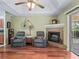 Inviting living room features a fireplace, comfortable seating, and natural light at 7260 Se 124Th Ln, Belleview, FL 34420